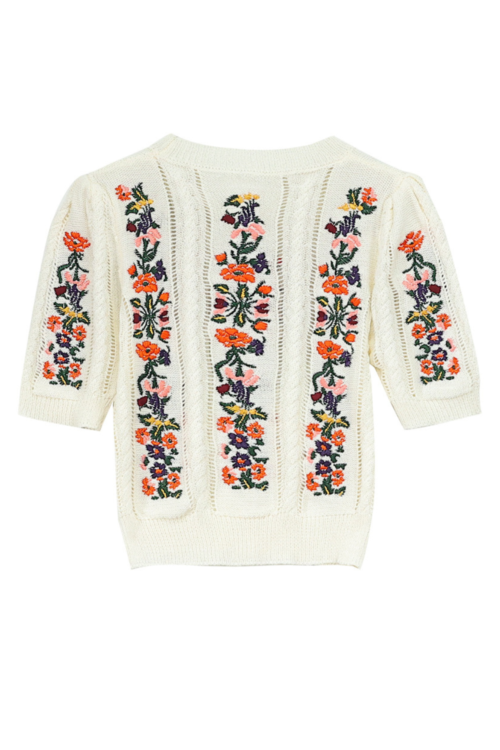 Stickad topp med broderade blommor