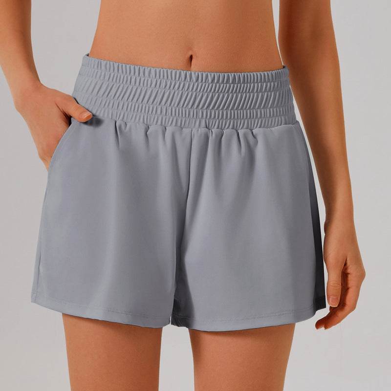 Högmidjade sportshorts med ficka