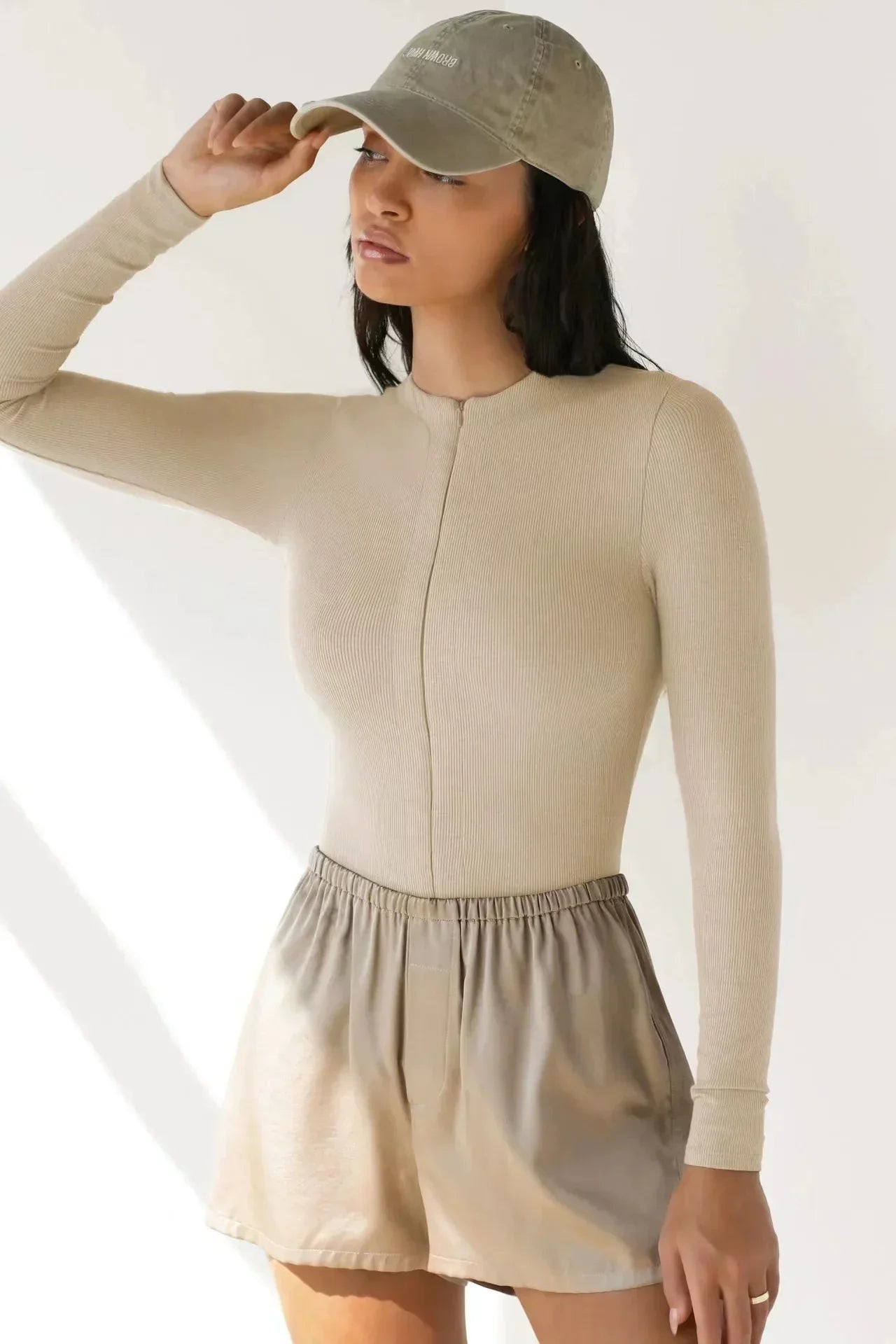 Bodysuit med dragkedja och långa ärmar