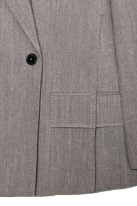 Grå jacka med slag och sidoslitsar