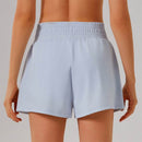 Högmidjade sportshorts med ficka