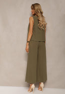 Grön tvådelad kostym, kortärmad jacka och utsvängda byxor