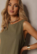 Grön tvådelad kostym, kortärmad jacka och utsvängda byxor