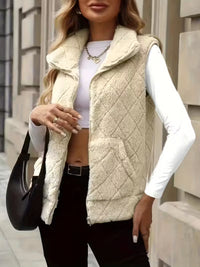 Ärmlös blus med dragkedja och hög krage