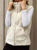 Ärmlös blus med dragkedja och hög krage