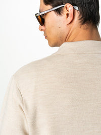 Beige, tunn jacka med knappar