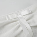 Elegant topp med rosett och bara axlar