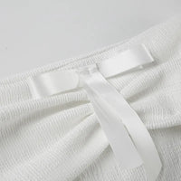 Elegant topp med rosett och bara axlar