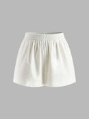 Set med halterneck-topp och shorts utan rygg