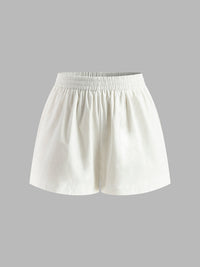 Set med halterneck-topp och shorts utan rygg