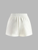 Set med halterneck-topp och shorts utan rygg