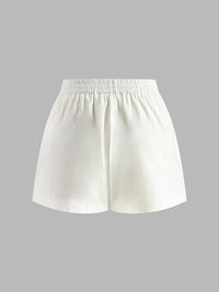 Set med halterneck-topp och shorts utan rygg