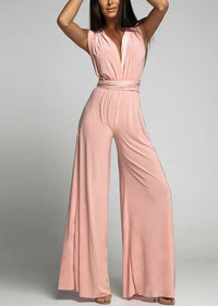 Ärmlös siamesisk kostym med djup V-ringning och utskuren rygg