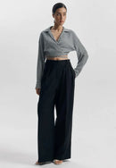 Avslappnad långärmad topp med dragsko runt magen