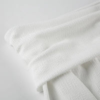 Elegant topp med rosett och bara axlar