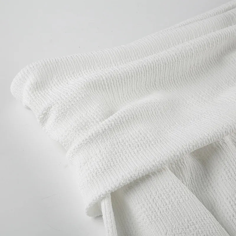 Elegant topp med rosett och bara axlar