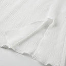 Elegant topp med rosett och bara axlar