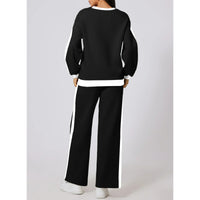 Träningsoverall med utsvängda byxor och huvtröja