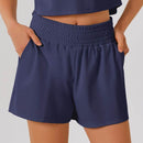 Högmidjade sportshorts med ficka