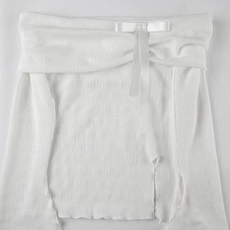 Elegant topp med rosett och bara axlar