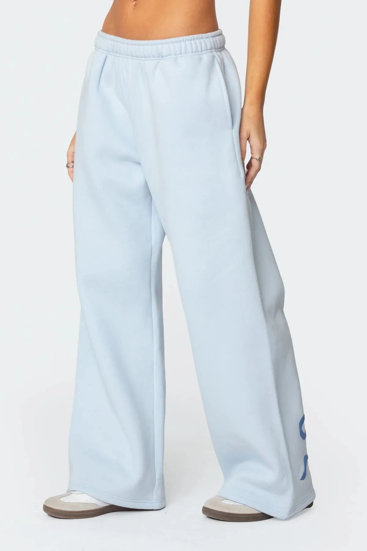 Träningsoverall med huva och rosettdesign