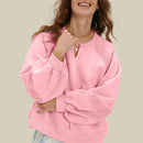 V-ringad tröja med handbroderad design