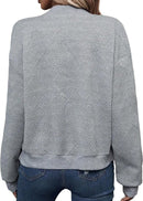 Grå stickad långärmad kofta med dekorativ dragkedja