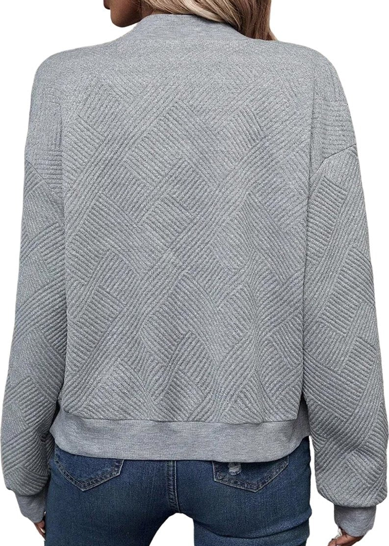 Grå stickad långärmad kofta med dekorativ dragkedja