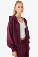 Brun träningsoverall med utsvängda byxor och dragkedja på blusen