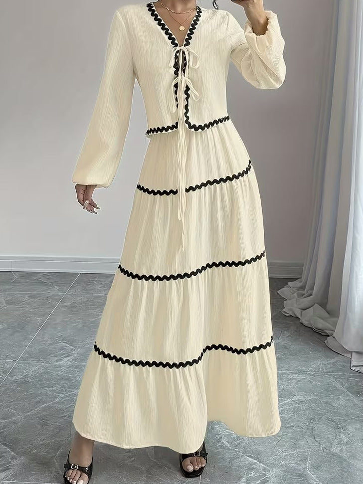 Vit kostym med lång kjol och blus över