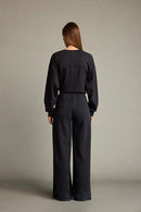 Veya sportdräkt med utsvängda byxor