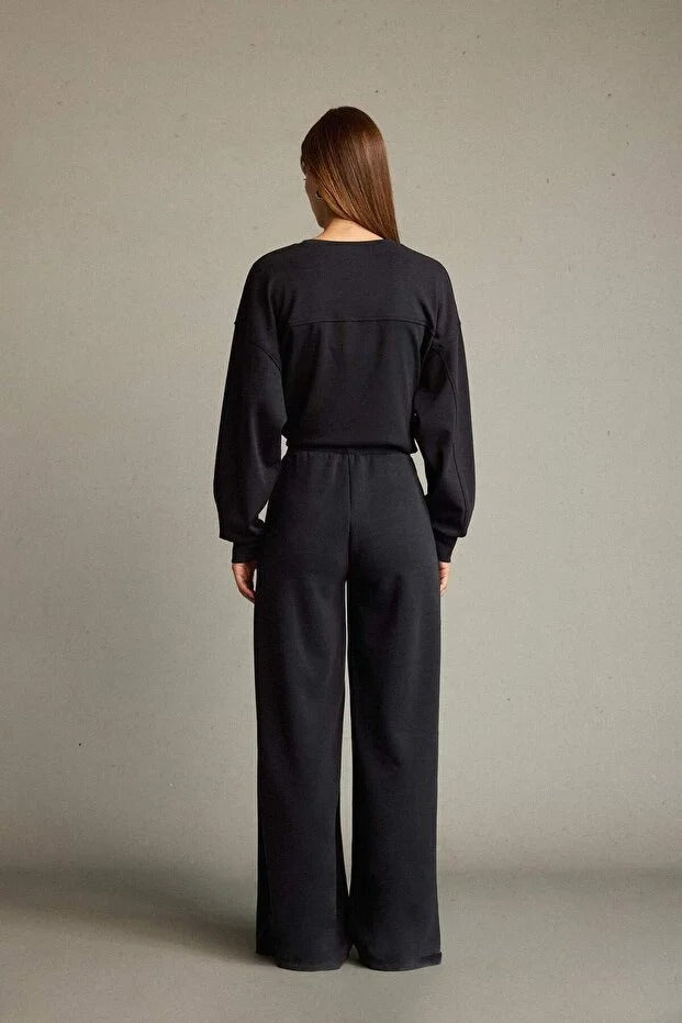 Veya sportdräkt med utsvängda byxor