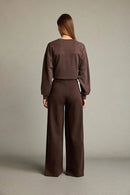 Veya sportdräkt med utsvängda byxor