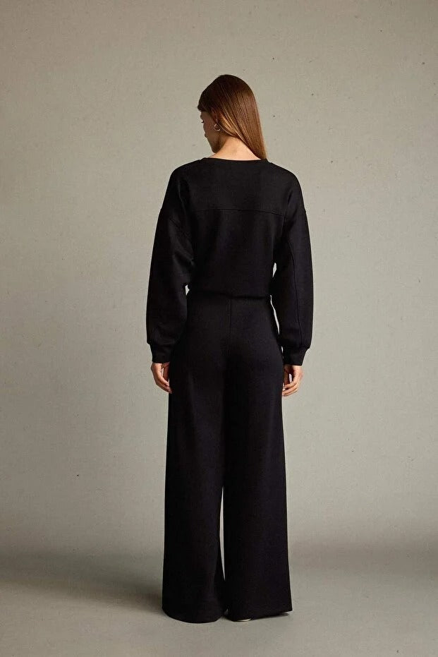 Veya sportdräkt med utsvängda byxor