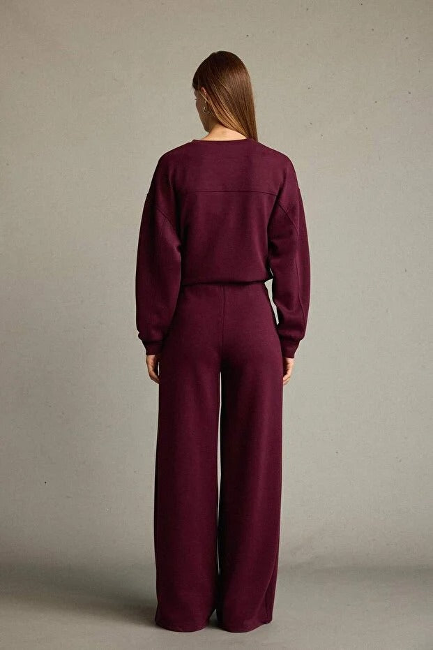 Veya sportdräkt med utsvängda byxor