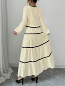 Vit kostym med lång kjol och blus över