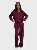 Tvådelad kostym, utsvängda byxor och huvtröja