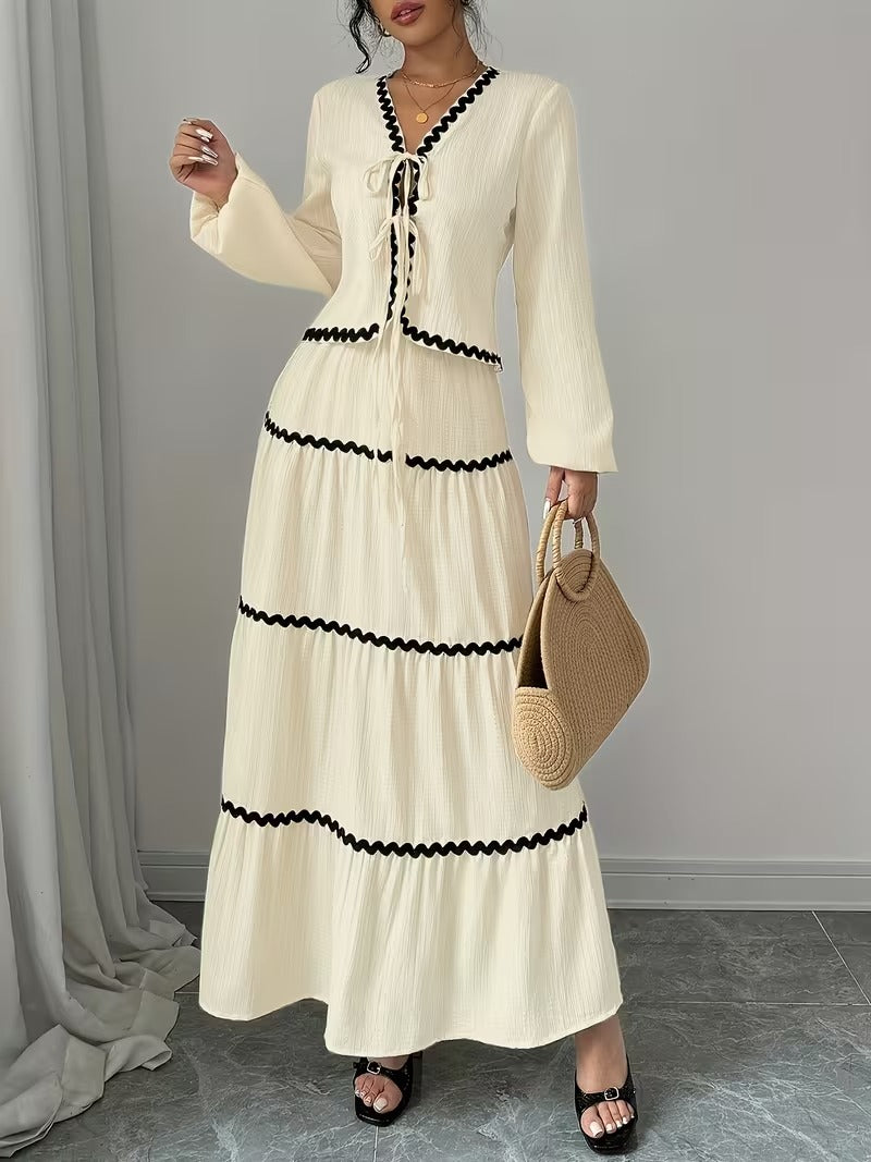 Vit kostym med lång kjol och blus över