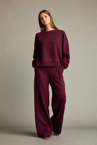 Veya sportdräkt med utsvängda byxor