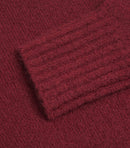 Vinröd tröja med långa ärmar och rund krage