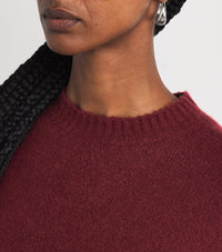 Vinröd tröja med långa ärmar och rund krage