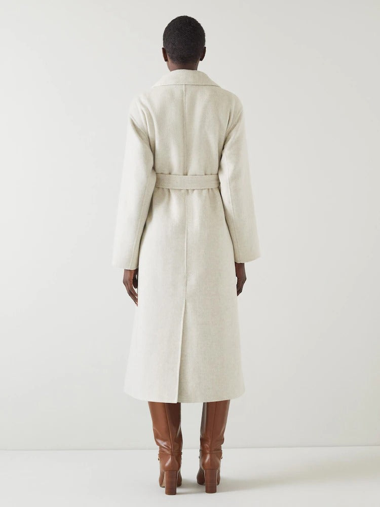 Ullkappa med dubbla rader knappar och skärp i midjan