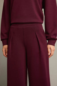 Veya sportdräkt med utsvängda byxor