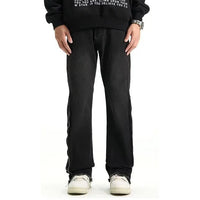 Svarta jeansbyxor med dragkedja nedtill