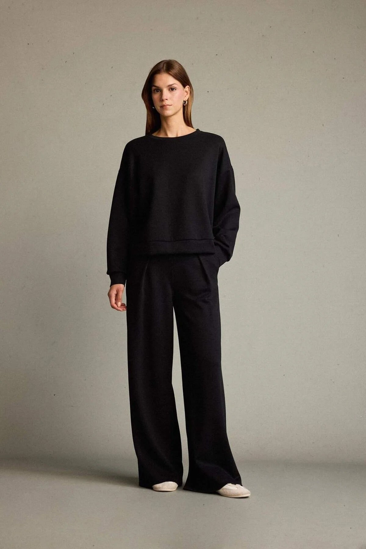 Veya sportdräkt med utsvängda byxor