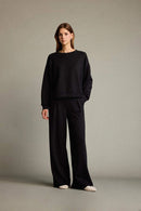 Veya sportdräkt med utsvängda byxor