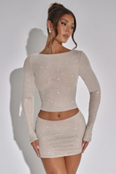 Vit glittrig kostym i två delar med kjol och långärmad skjorta