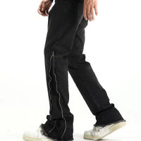 Svarta jeansbyxor med dragkedja nedtill