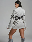 Långärmad jacka med knappar och korsett