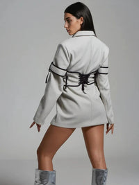 Långärmad jacka med knappar och korsett